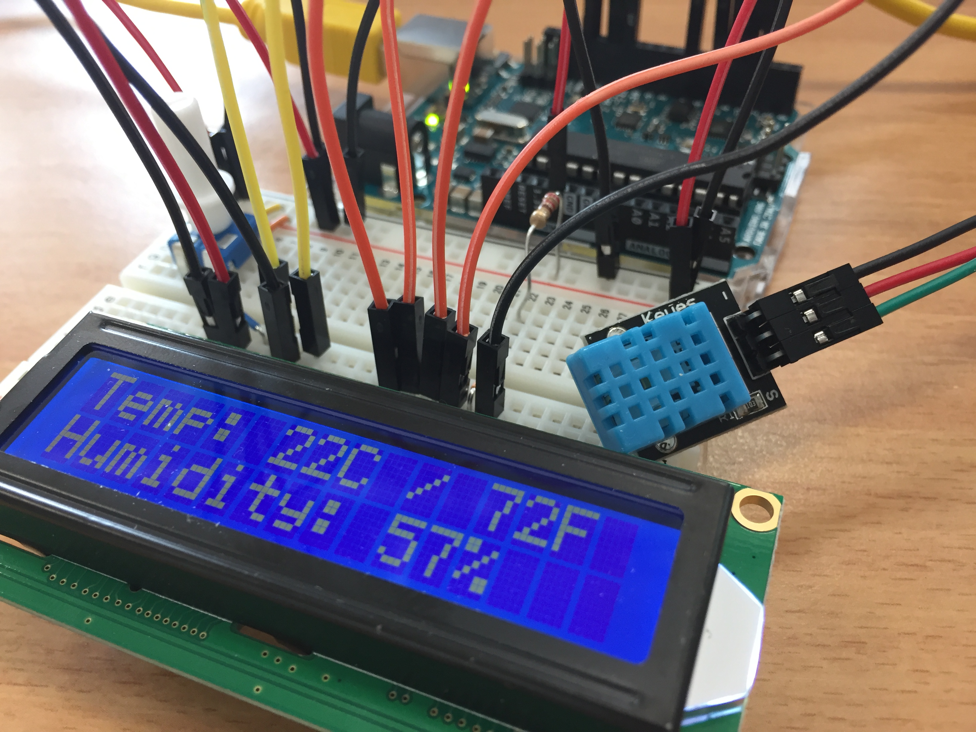Arduino Uno with DHT11 temperature and humidity sensor data displayed on LCD