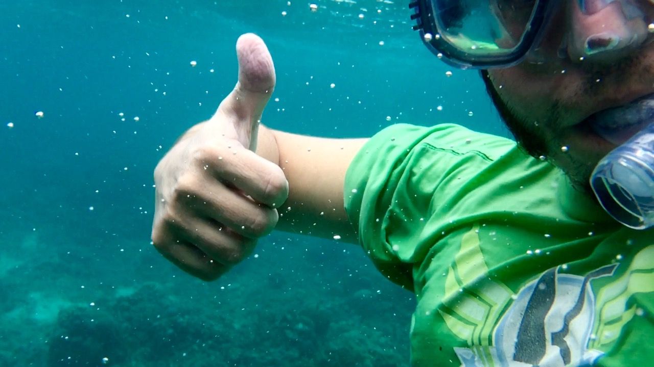 Underwater picture of Chris snorkeling in Indonesia.