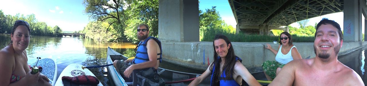 Picture of friends canoeing on a river.