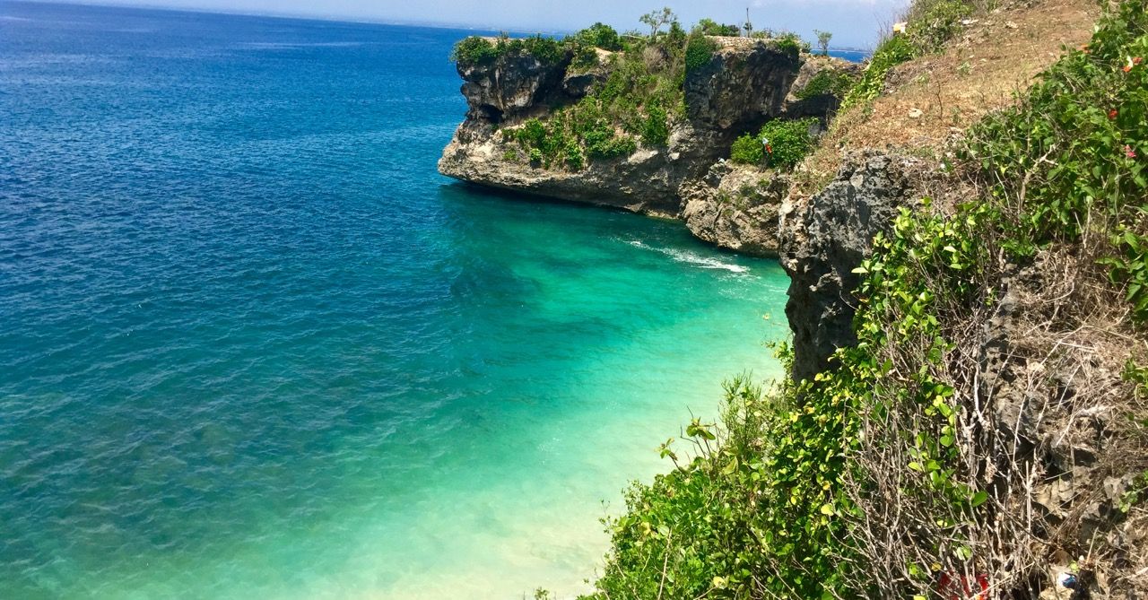 A white sand beach photographed from above.