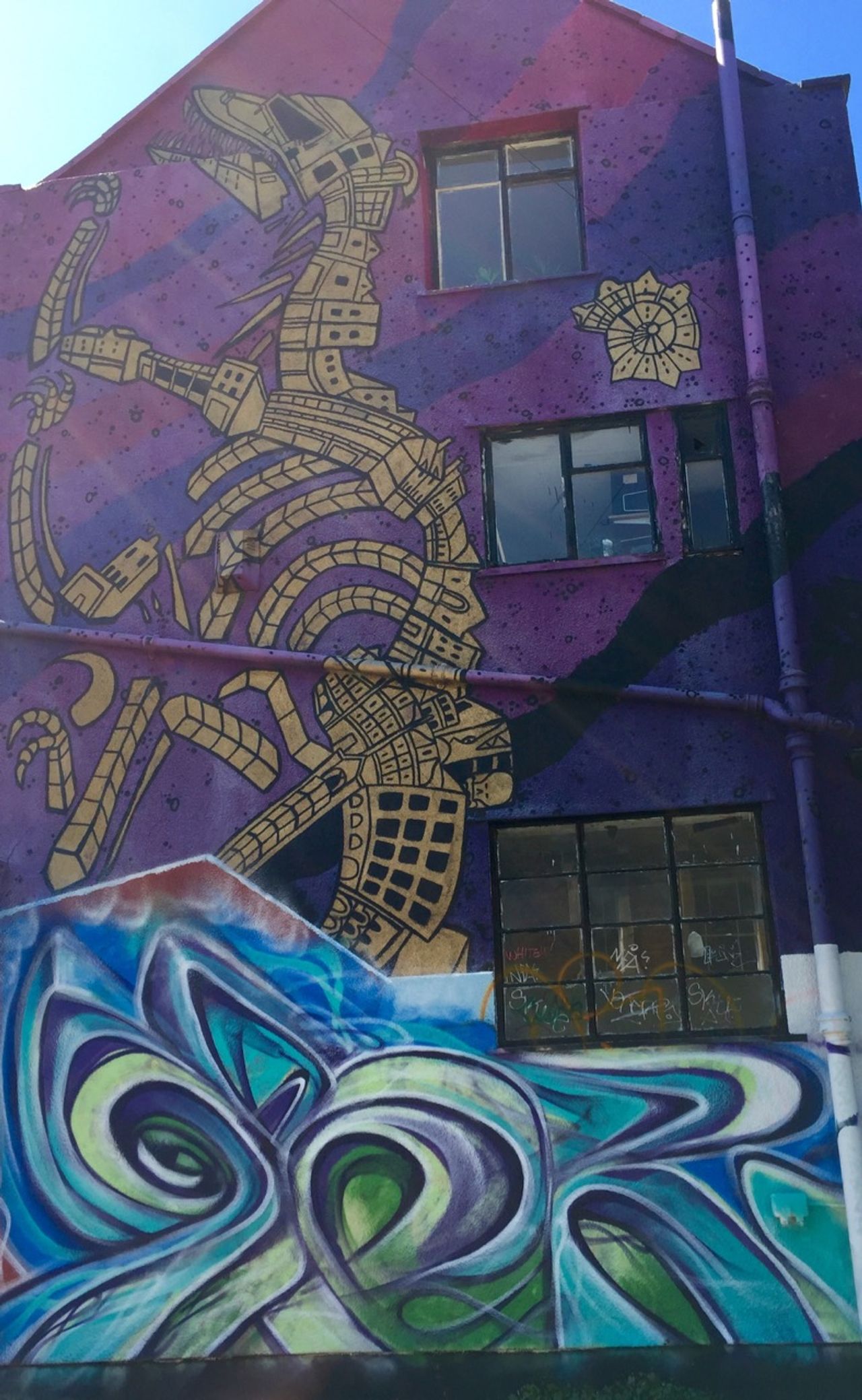 Graffiti of a large mechanical dragon.