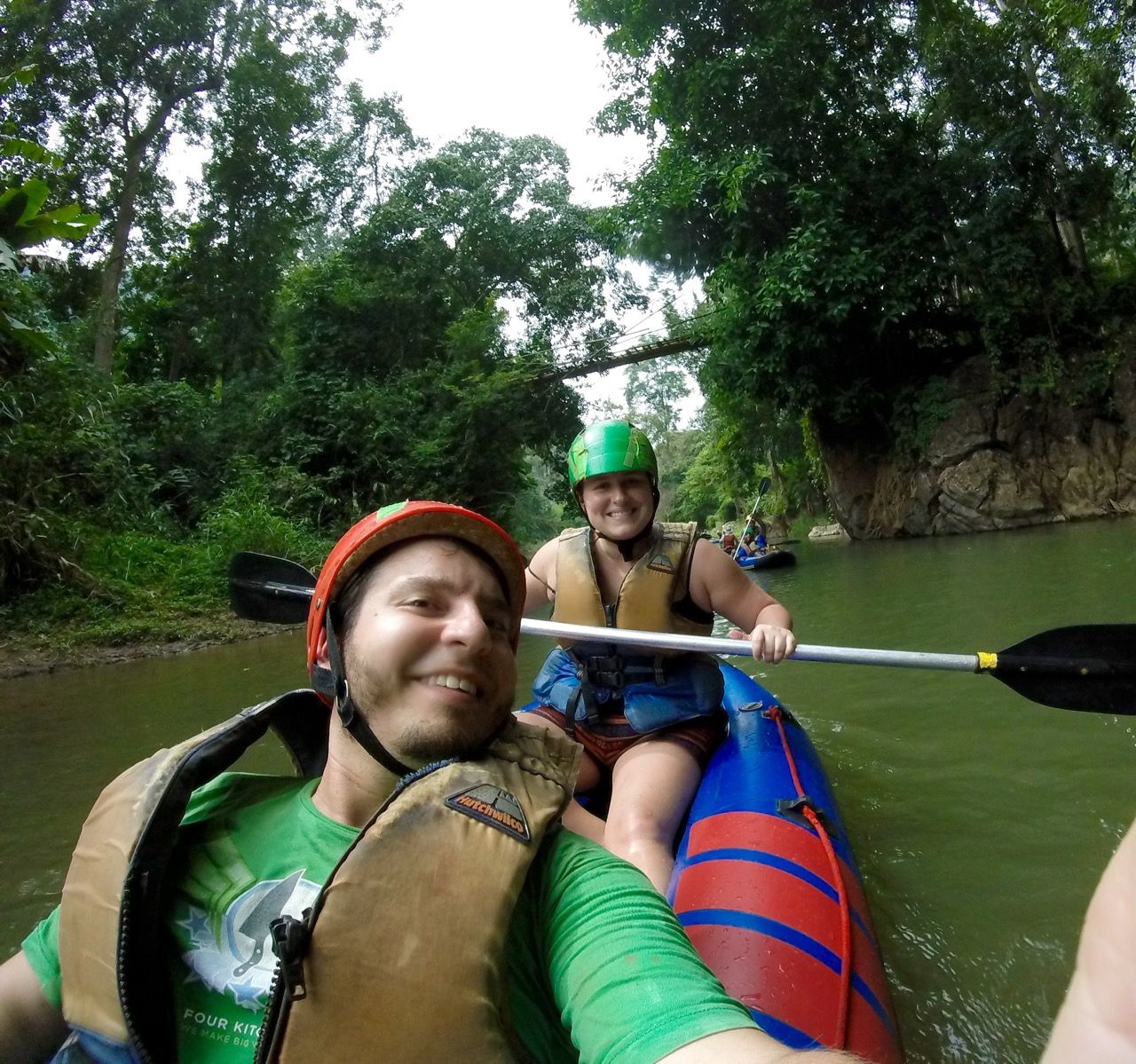 Two happy kayakers smiling into the camera.