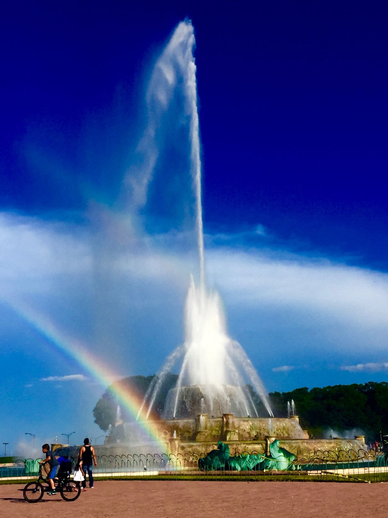 Rainbow caused by the spray of a fountain.