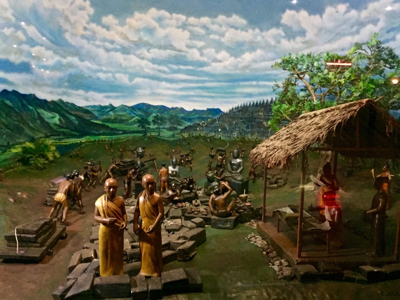 Historical diorama involving Borobudur temple.