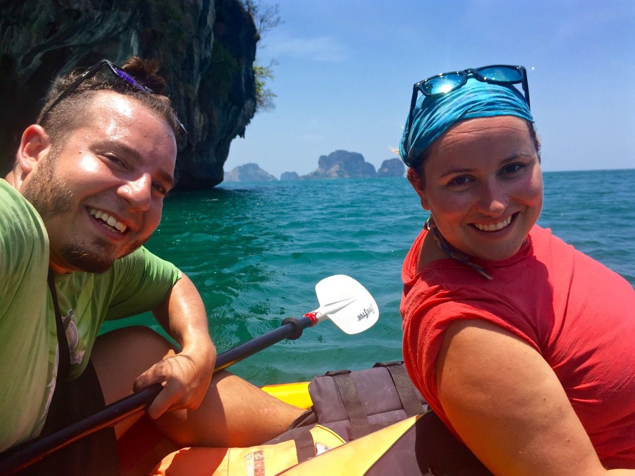 Man and woman smiling into camera.