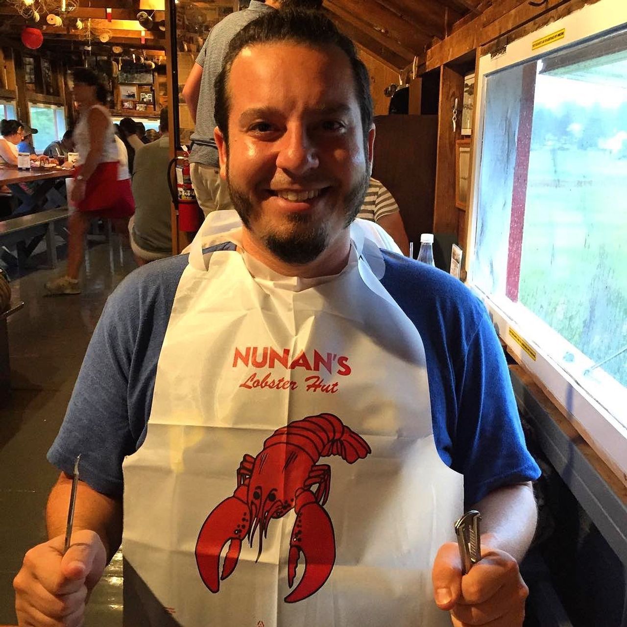 Man ready to eat lobster.