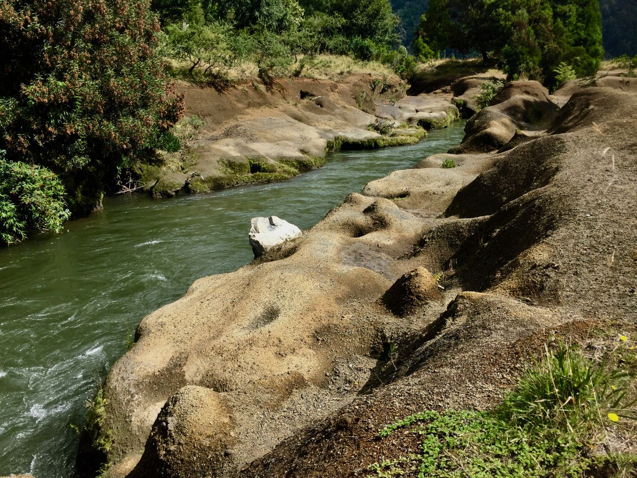 River with well-worn rock banks.