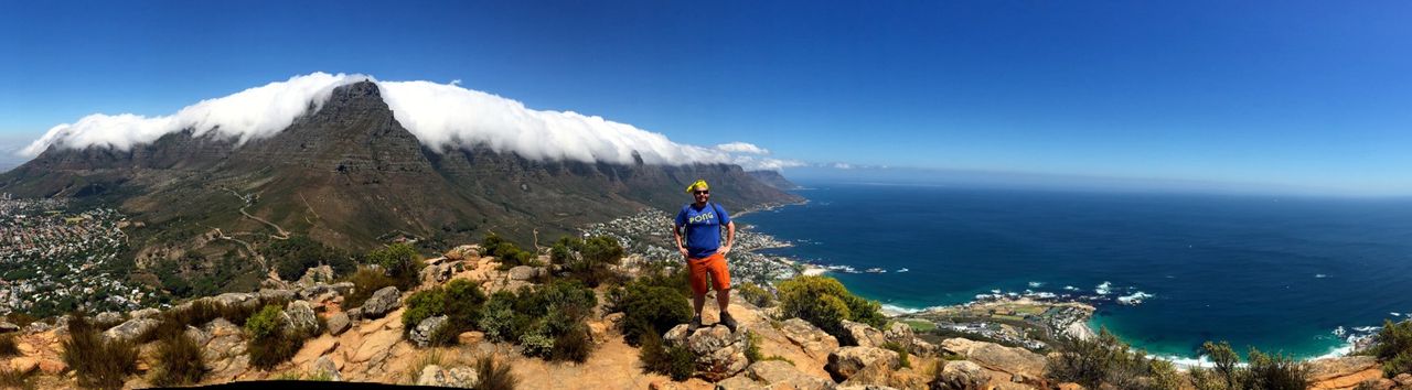 Man posing at the top of Lion's Head.