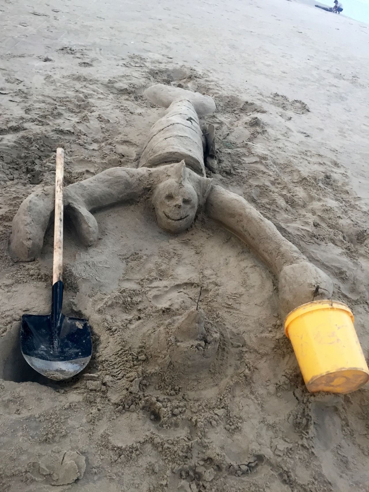 Crab-clown-shark building a sandcastle