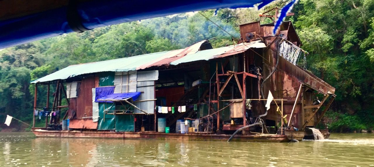 A large houseboat on the Ou River.