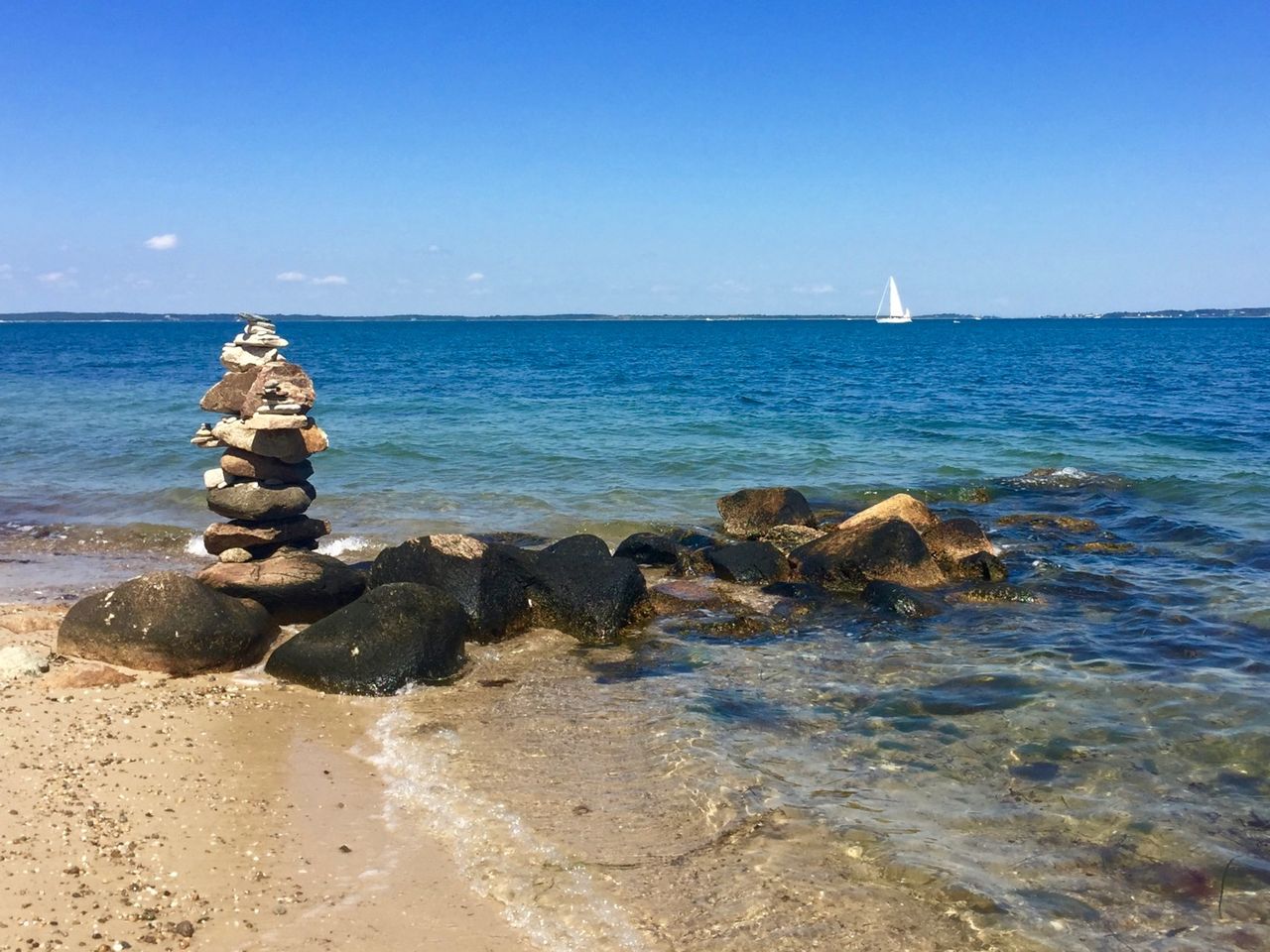 A stone totem on a beach.