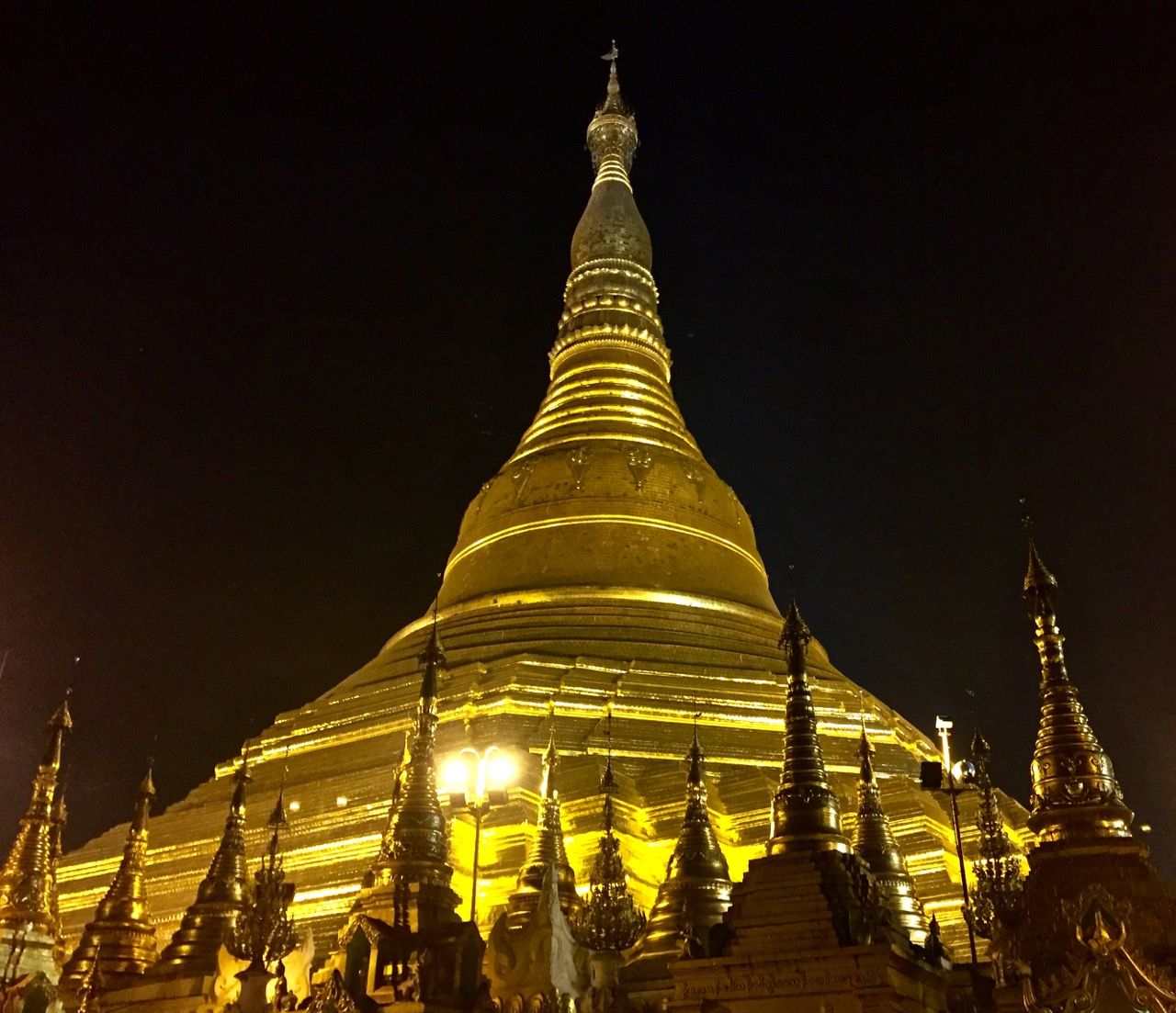 The Shwedagon Pagoda gleaming against the night sky.