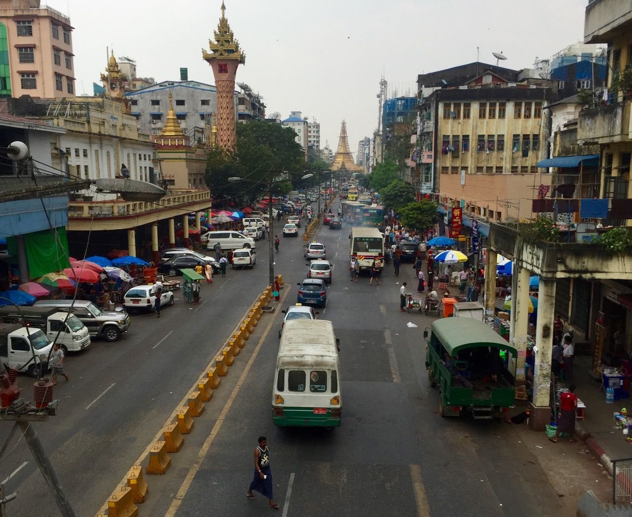 View from a raised pedestrian bridge with Sule Pagoda in the background.