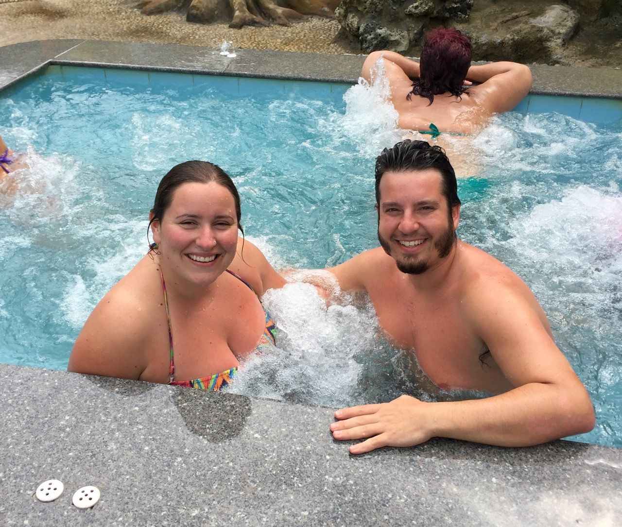 Two people smiling in a spa.