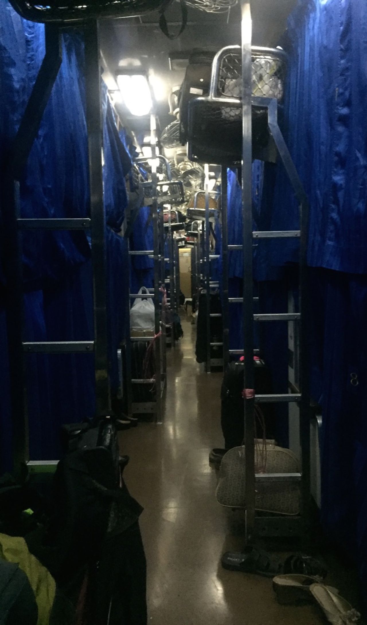 A night train car with all the bunk curtains closed