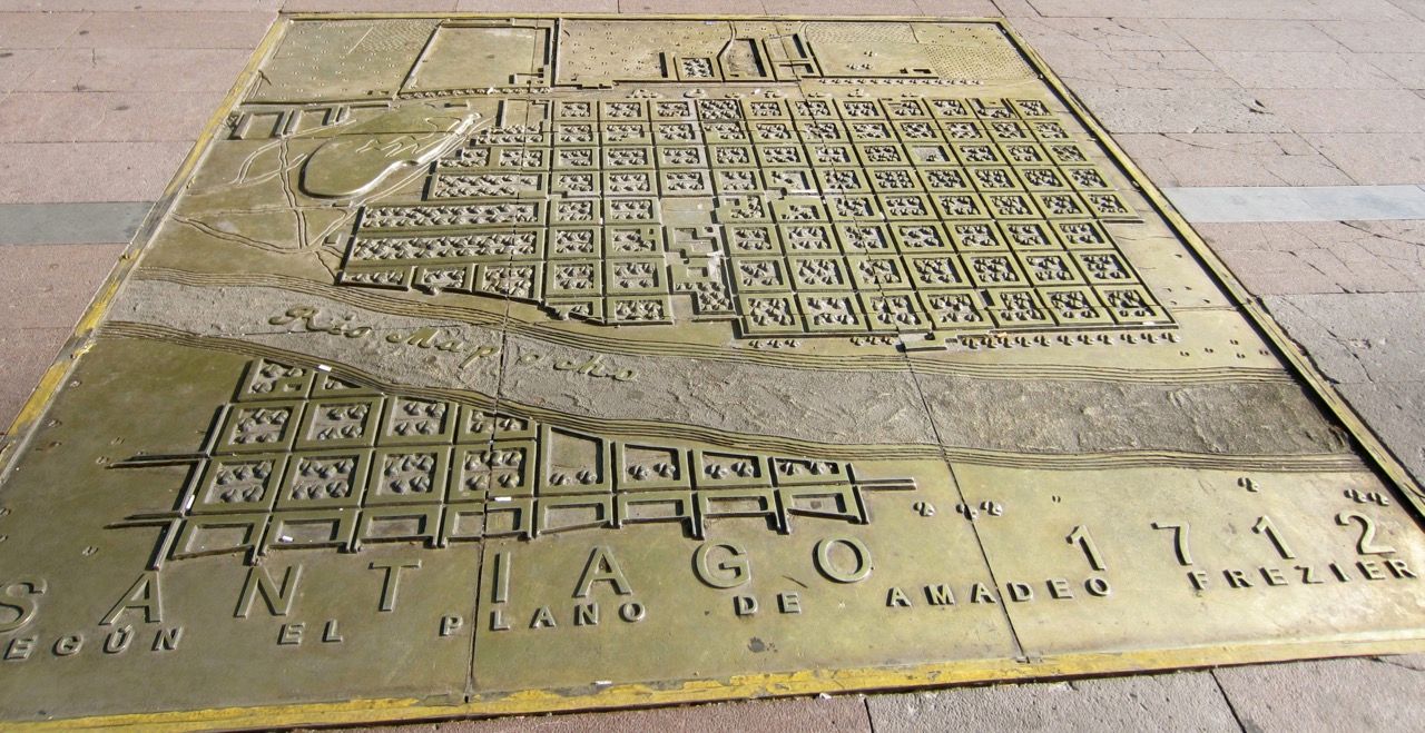 A brass plate featuring a diagram of Santiago in the 1700s.
