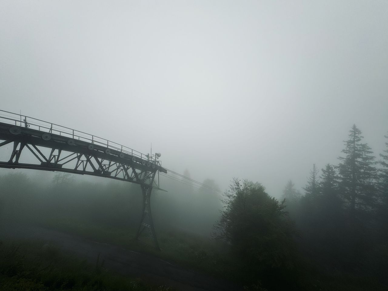 Looking at the Bergstation with a thick fog that obscures all background scenery