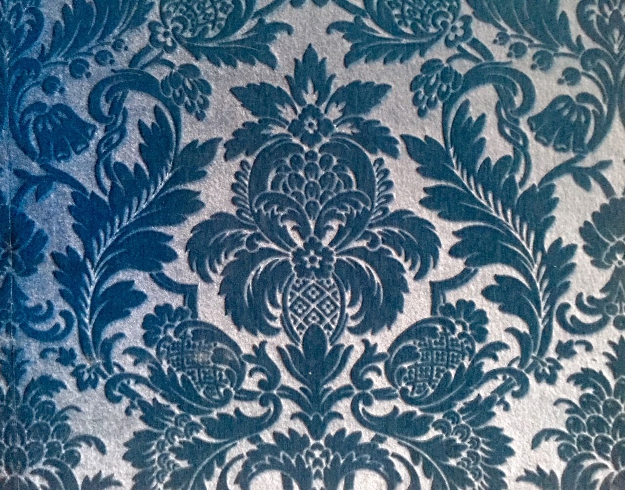 A blue carpeted wallpaper.